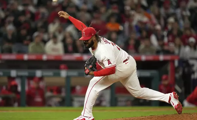 Los Angeles Angels relief pitcher Kenley Jansen throws to the plate during the ninth inning of a baseball game against the San Francisco Giants, Friday, April 18, 2025, in Anaheim, Calif. (AP Photo/Mark J. Terrill)