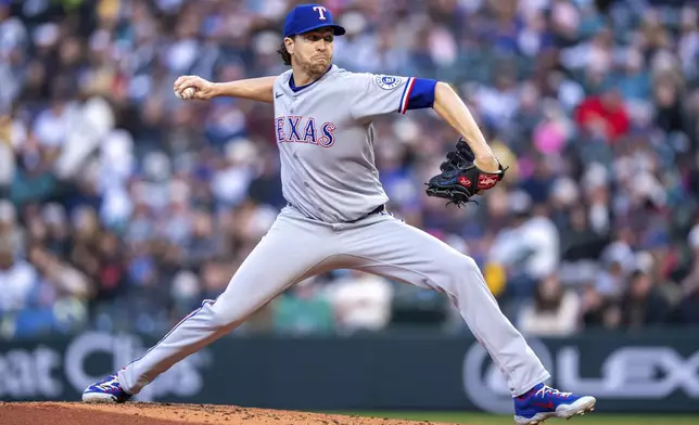 Texas Rangers starter Jacob deGrom delivers a pitch during the second inning of a baseball game against the Seattle Mariners, Friday, April 11, 2025, in Seattle. (AP Photo/Stephen Brashear)