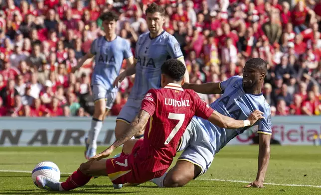 Liverpool's Luis Diaz scores his side's first goal during the English Premier League soccer match between Liverpool and Tottenham Hotspur at Anfield in Liverpool, England, Sunday, April 27, 2025. (AP Photo/Jon Super)