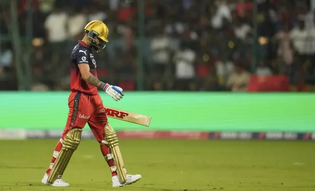 Royal Challengers Bengaluru's Virat Kohli walks off the field after losing his wicket during the Indian Premier League cricket match between Royal Challengers Bengaluru and Punjab Kings at Chinnaswamy Stadium in Bengaluru, India, Friday, April 18, 2025. (AP Photo/Aijaz Rahi)