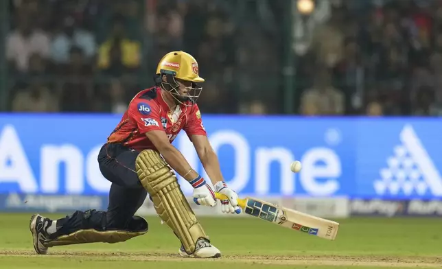 Punjab Kings' Nehal Wadhera plays a shot during the Indian Premier League cricket match between Royal Challengers Bengaluru and Punjab Kings at Chinnaswamy Stadium in Bengaluru, India, Friday, April 18, 2025. (AP Photo/Aijaz Rahi)