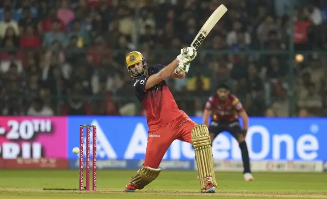 Royal Challengers Bengaluru's Tim David during the Indian Premier League cricket match between Royal Challengers Bengaluru and Punjab Kings at Chinnaswamy Stadium in Bengaluru, India, Friday, April 18, 2025. (AP Photo/Aijaz Rahi)