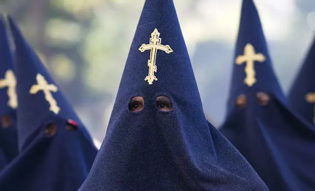 Hooded penitents take part in a Good Friday procession during Holy Week in La Paz, Bolivia, Friday, April 18, 2025. (AP Photo/Juan Karita)