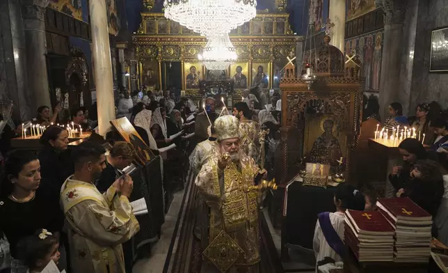 Palestinian Christians attend a Good Friday Mass at the Greek Orthodox Church of Saint Porphyrius in Gaza City, Friday, April 18, 2025. (AP Photo/Jehad Alshrafi)
