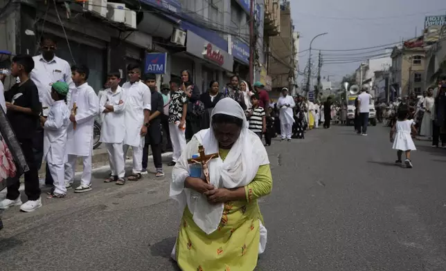 Christians participate in a procession to mark Good Friday, in Jammu, India, Friday, April 18, 2025. (AP Photo/Channi Anand)