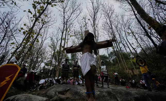 Christians reenact the crucifixion of Jesus Christ to mark Good Friday in Guwahati, India, Friday, April 18, 2025. (AP Photo/Anupam Nath)