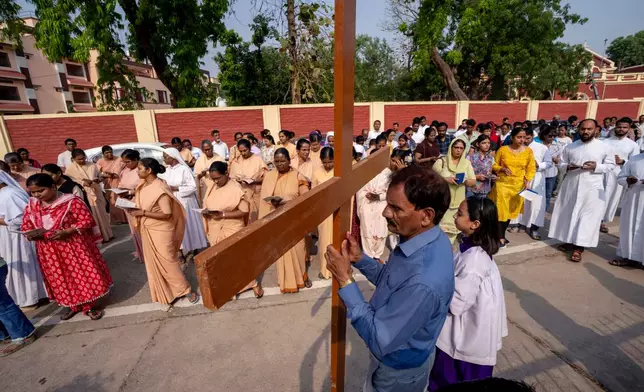 Christian devotees take out a procession to mark Good Friday outside St. Joseph Cathedral in Prayagraj, in the northern Indian state of Uttar Pradesh, Friday, April 18, 2025 (AP Photo/Rajesh Kumar Singh)