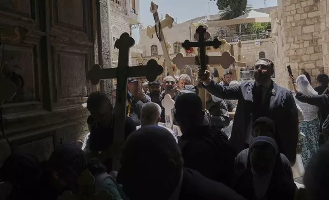 Christian pilgrims carry crosses during Good Friday procession in the Old City of Jerusalem on Friday, April 18, 2025. (AP Photo/Mahmoud Illean)