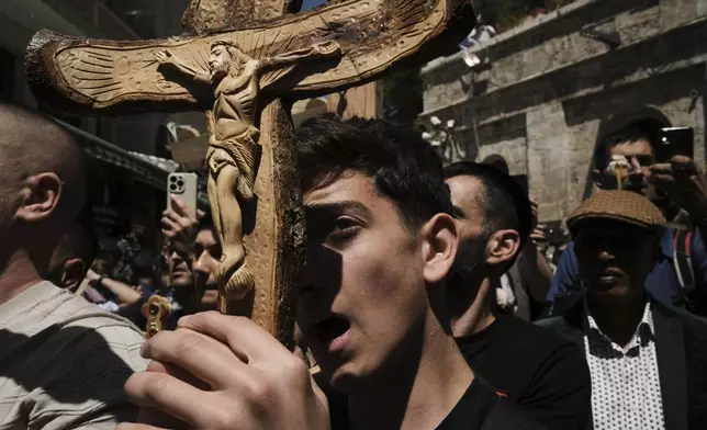 Christian pilgrims carry crosses during Good Friday procession in the Old City of Jerusalem on Friday, April 18, 2025. (AP Photo/Leo Correa)