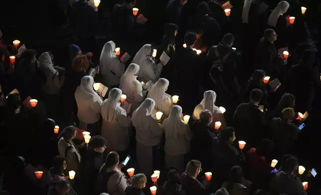Nuns attend the procession outside the Colosseum during the Via Crucis (Latin for 'way of the cross') in Rome, Friday, April 18, 2025. (AP Photo/Andrew Medichini)