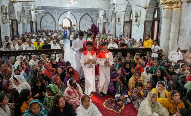 Christians attend a prayer service at St. Anthony Church, marking Good Friday, in Lahore, Pakistan, Friday, April 18, 2025. (AP Photo/K.M. Chaudary)