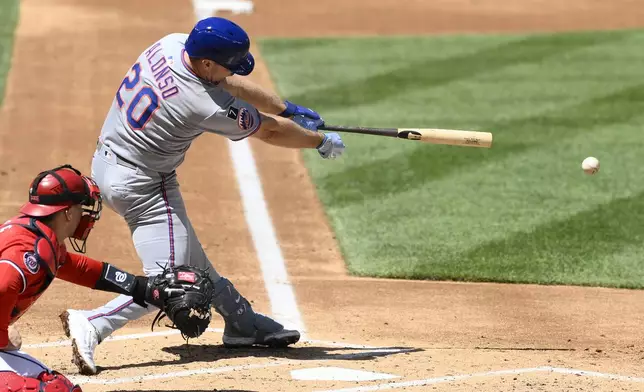 New York Mets' Pete Alonso singles during the second inning of a baseball game against the Washington Nationals, Sunday, April 27, 2025, in Washington. (AP Photo/Nick Wass)