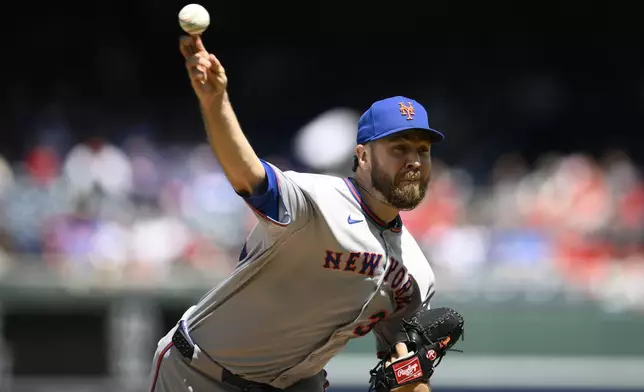 New York Mets starting pitcher Tylor Megill throws during the first inning of a baseball game against the Washington Nationals, Sunday, April 27, 2025, in Washington. (AP Photo/Nick Wass)