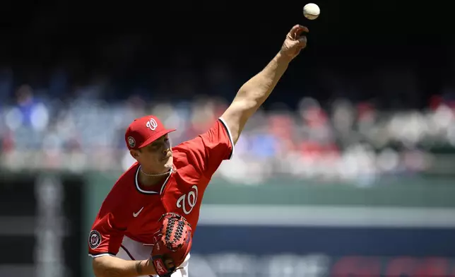 Washington Nationals starting pitcher Mitchell Parker throws during the first inning of a baseball game against the New York Mets, Sunday, April 27, 2025, in Washington. (AP Photo/Nick Wass)