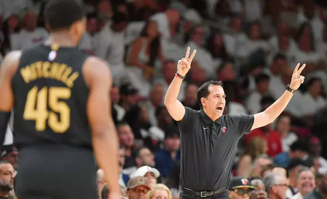 Miami Heat coach Erik Spoelstra shouts instructions to his team during the first half in Game 3 of an NBA basketball first-round playoff series against the Cleveland Cavaliers, Saturday, April 26, 2025, in Miami. (AP Photo/Michael Laughlin)