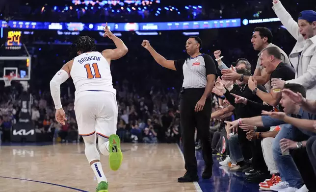 New York Knicks guard Jalen Brunson reacts after a three point shot during the first half of Game 1 in an NBA basketball first-round playoff series against the Detroit Pistons, Saturday, April 19, 2025, in New York. (AP Photo/Julia Demaree Nikhinson)