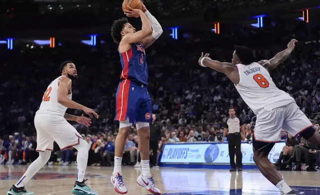 Detroit Pistons guard Cade Cunningham (2) shoots past New York Knicks forward OG Anunoby (8) during the first half of Game 1 in an NBA basketball first-round playoff series, Saturday, April 19, 2025, in New York. (AP Photo/Julia Demaree Nikhinson)