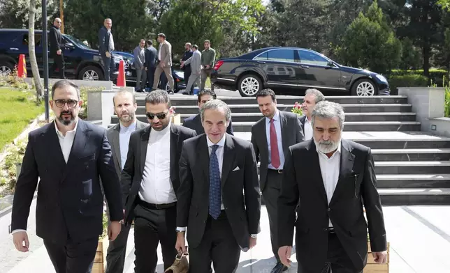In this photo, released by the Atomic Energy Organisation of Iran, International Atomic Energy Agency (IAEA) Director General, Rafael Mariano Grossi, front center, arrives at Atomic Energy Organisation of Iran, in Tehran, Iran, Thursday, April 17, 2025. (Atomic Energy Organisation of Iran via AP)