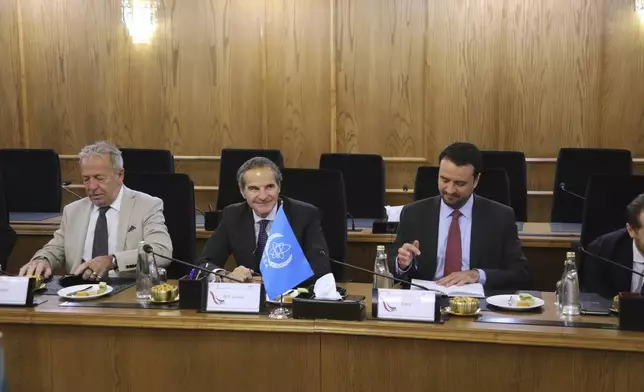 In this photo, released by the Atomic Energy Organisation of Iran, International Atomic Energy Agency (IAEA) Director General, Rafael Mariano Grossi, center, attends a meeting with head of the Atomic Energy Organization of Iran Mohammad Eslami, in Tehran, Iran, Thursday, April 17, 2025. (Atomic Energy Organisation of Iran via AP)
