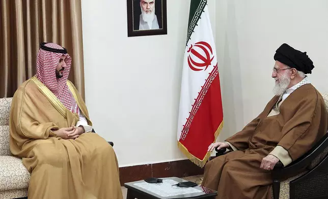In this photo released by the official website of the office of the Iranian supreme leader, Supreme Leader Ayatollah Ali Khamenei, right, listens to Saudi Arabia's Defense Minister Prince Khalid bin Salman during their meeting in Tehran, Iran, Thursday, April 17, 2025. (Office of the Iranian Supreme Leader via AP)
