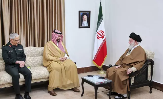 In this photo released by an official website of the office of the Iranian supreme leader, Supreme Leader Ayatollah Ali Khamenei, right, listens to Saudi Arabia's Defense Minister Prince Khalid bin Salman, center, as Chief of the General Staff of Iran's Armed Forces Gen. Mohammad Hossein Bagheri attends their meeting in Tehran, Iran, Thursday, April 17, 2025. (Office of the Iranian Supreme Leader via AP)