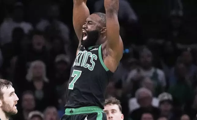 Boston Celtics guard Jaylen Brown (7) dunks against the Orlando Magic during the first half in game 5 of a first-round NBA playoff basketball series, Tuesday, April 29, 2025, in Boston. (AP Photo/Charles Krupa)