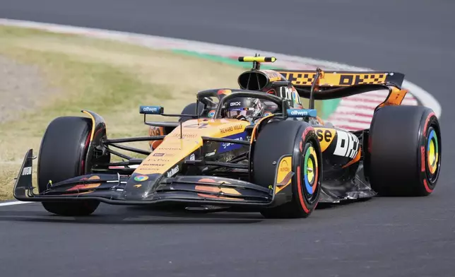 McLaren driver Lando Norris of Britain steers his car during the qualifying session for the Japanese Formula One Grand Prix at the Suzuka Circuit in Suzuka, central Japan, Saturday, April 5, 2025. (AP Photo/Hiro Komae)