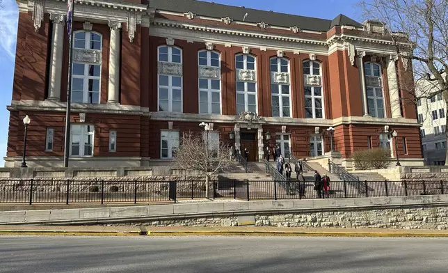 People gather outside the Missouri Supreme Court building on March 12, 2025, in Jefferson City, Mo. (AP Photo/David A. Lieb)