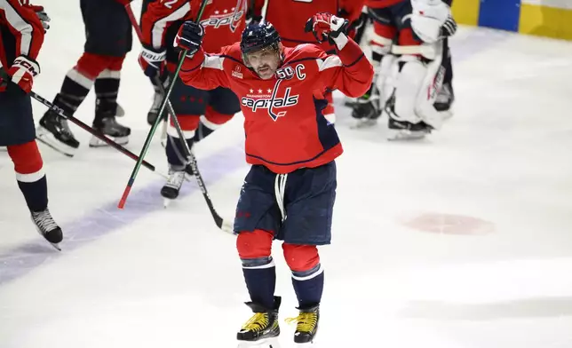 Washington Capitals left wing Alex Ovechkin (8) celebrates after Game 1 of a first-round NHL hockey playoff series past against the Montreal Canadiens, Monday, April 21, 2025, in Washington. (AP Photo/Nick Wass)