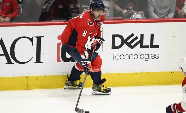 Washington Capitals left wing Alex Ovechkin (8) skates with the puck in the third period of Game 2 of a first-round NHL hockey playoff series against the Montreal Canadiens Wednesday, April 23, 2025, in Washington. (AP Photo/Nick Wass)