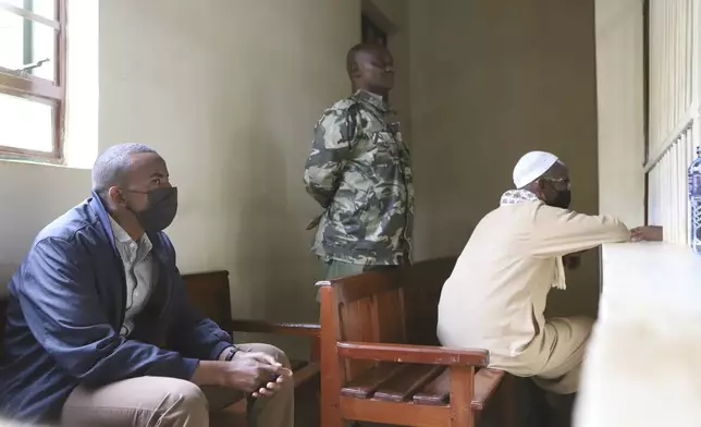 Hussein Mohamed Abdille Ali, left, and Mohammed Abdi Ali, right, sit in the dock at the Kahawa Law Courts, Nairobi, Kenya Thursday, May 22, 2025. (AP Photo/Andrew Kasuku)