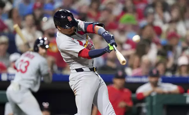 St. Louis Cardinals' Masyn Winn hits a home run against Philadelphia Phillies pitcher Matt Strahm during the seventh inning of a baseball game Monday, May 12, 2025, in Philadelphia. (AP Photo/Matt Slocum)