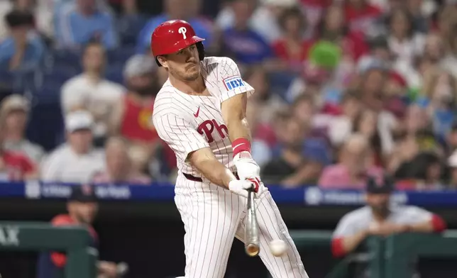 Philadelphia Phillies' J.T. Realmuto drives in a run on a fielder's choice against St. Louis Cardinals pitcher Matthew Liberatore during the sixth inning of a baseball game Monday, May 12, 2025, in Philadelphia. (AP Photo/Matt Slocum)