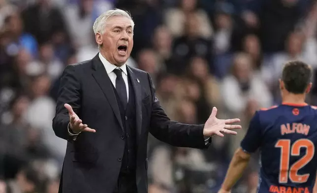 Real Madrid's head coach Carlo Ancelotti reacts during the Spanish La Liga soccer match between Real Madrid and Celta Vigo at the Santiago Bernabeu stadium in Madrid, Spain, Sunday, May 4, 2025. (AP Photo/Jose Breton)