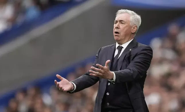 Real Madrid's head coach Carlo Ancelotti reacts during the Spanish La Liga soccer match between Real Madrid and Celta Vigo at the Santiago Bernabeu stadium in Madrid, Spain, Sunday, May 4, 2025. (AP Photo/Jose Breton)