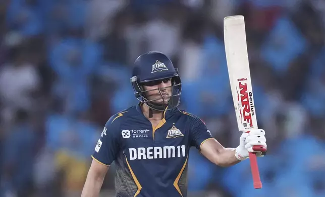 Gujarat Titans' captain Shubman Gill celebrates after scoring fifty runs during the Indian Premier League cricket match between Gujarat Titans and Sunrisers Hyderabad at Narendra Modi Stadium in Ahmedabad, India, Friday, May 2, 2025. (AP Photo/Siddharaj Solanki)