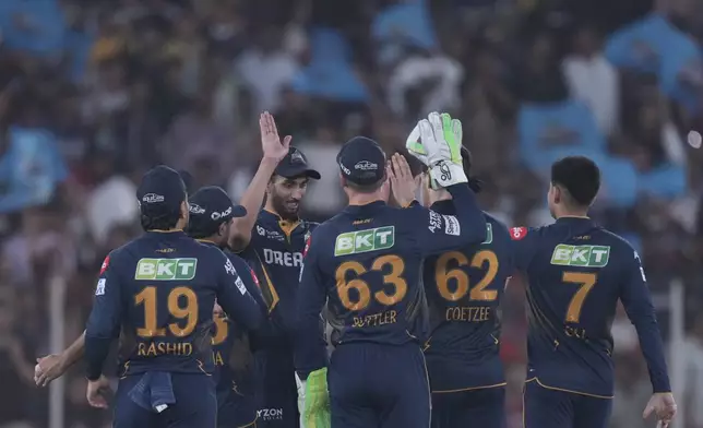 Gujarat Titans players celebrates the dismissal of Sunrisers Hyderabad's Ishan Kishan during the Indian Premier League cricket match between Gujarat Titans and Sunrisers Hyderabad at Narendra Modi Stadium in Ahmedabad, India, Friday, May 2, 2025. (AP Photo/Siddharaj Solanki)