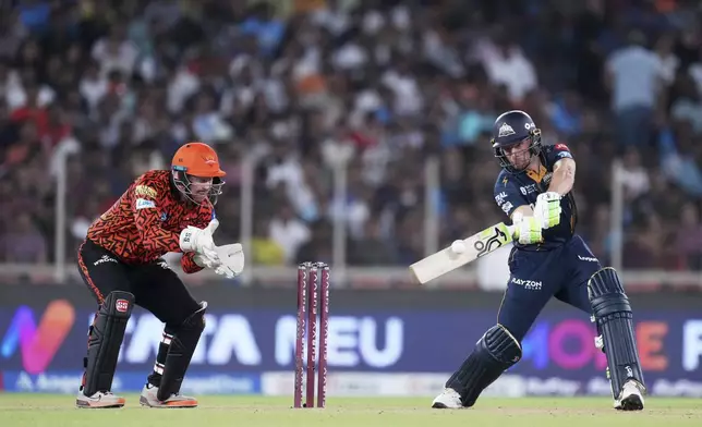 Gujarat Titans' Jos Butler plays a shot during the Indian Premier League cricket match between Gujarat Titans and Sunrisers Hyderabad at Narendra Modi Stadium in Ahmedabad, India, Friday, May 2, 2025. (AP Photo/Siddharaj Solanki)