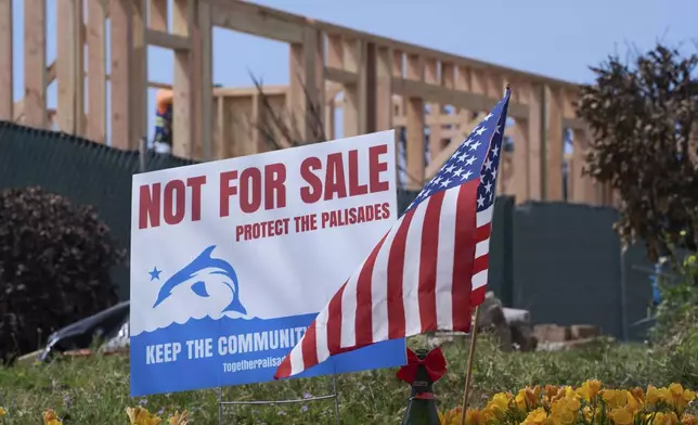 Construction begins in the Palisades Fire devastation zone in the Pacific Palisades neighborhood of Los Angeles, Thursday, April 24, 2025. (AP Photo/Damian Dovarganes)