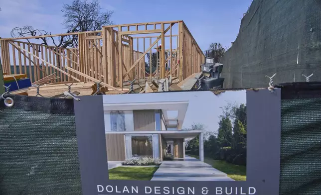 A home is rebuilt in the Palisades Fire damage zone in the Pacific Palisades neighborhood of Los Angeles, Thursday, April 24, 2025. (AP Photo/Damian Dovarganes)
