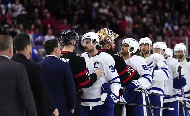 Ottawa Senators' Brady Tkachuk (7) shakes hands with Toronto Maple Leafs' Auston Matthews (34) after the Maple Leafs defeated the Senators to eliminate them from the NHL hockey playoffs in Ottawa, Ontario, Thursday, May 1, 2025. (Justin Tang/The Canadian Press via AP)