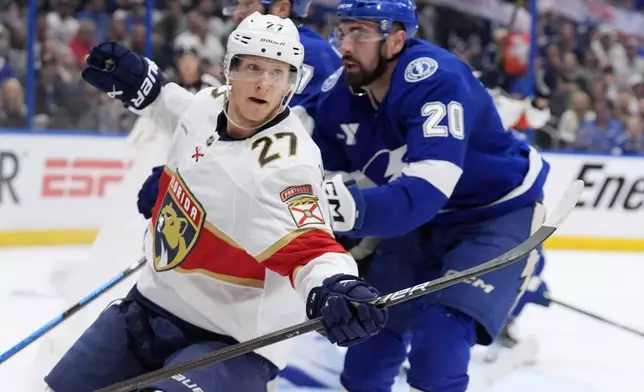 Florida Panthers center Eetu Luostarinen (27) celebrates his goal against the Tampa Bay Lightning during the third period in Game 5 of an NHL hockey Stanley Cup first-round playoff series, Wednesday, April 30, 2025, in Tampa, Fla. (AP Photo/Chris O'Meara)
