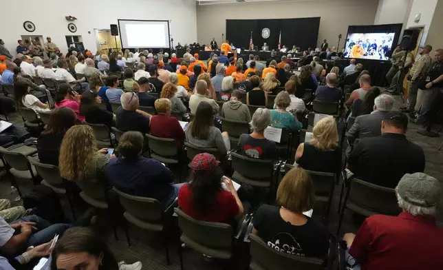 An overflow crowd fills the room at a Florida Fish &amp; Wildlife Commission hearing about proposed bear hunting Wednesday, May 21, 2025, in Ocala, Fla. (AP Photo/John Raoux)