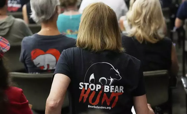 Citizens attending a Florida Fish &amp; Wildlife Commission hearing about proposed bear hunting, wear t-shirts against legalized bear hunting in Florida Wednesday, May 21, 2025, in Ocala, Fla. (AP Photo/John Raoux)