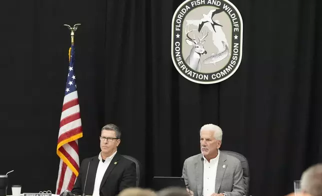 Florida Fish &amp; Wildlife Commission executive director Roger Young, left, and chairman Rodney Barreto conduct a hearing about proposed bear hunting in Florida Wednesday, May 21, 2025, in Ocala, Fla. (AP Photo/John Raoux)
