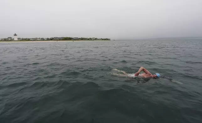 Endurance swimmer Louis Pugh swims off the coast pf Edgartown, Mass., Thursday, May 15, 2025. (AP Photo/Robert F. Bukaty)