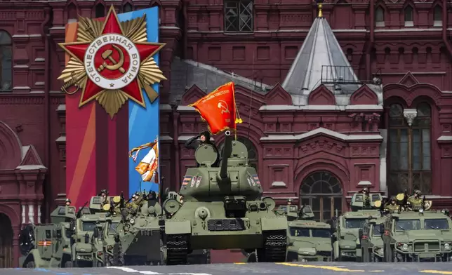 FILE - A Soviet-era tank and armored military vehicles participate in a Victory Day parade dress rehearsal at Red Square in Moscow on May 5, 2024. (AP Photo/Alexander Zemlianichenko, File)