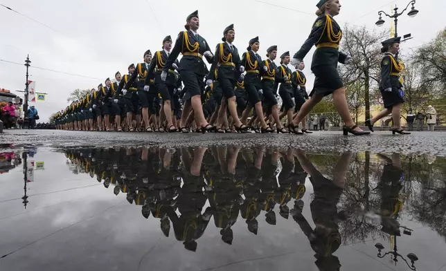 Russian army servicewomen march to attend a dress rehearsal for the Victory Day military parade at the Dvortsovaya (Palace) Square in St. Petersburg, Russia, Wednesday, May 7, 2025. (AP Photo/Dmitri Lovetsky)