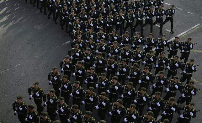 Russian servicemen march towards the Red Square prior to the Victory Day military parade general rehearsal in Moscow, Russia, Wednesday, May 7, 2025. (AP Photo/Pavel Bednyakov)