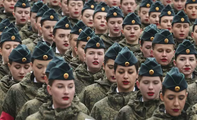 Russian army servicewomen march to attend a rehearsal for the Victory Day military parade at the Dvortsovaya (Palace) Square in St. Petersburg, Russia, Monday, May 5, 2025. (AP Photo/Dmitri Lovetsky)